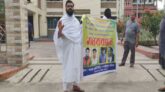 কাফনের কাপড় পড়ে ছাত্রলীগ নেতার বিরুদ্ধে দম্পতির প্রতিবাদ